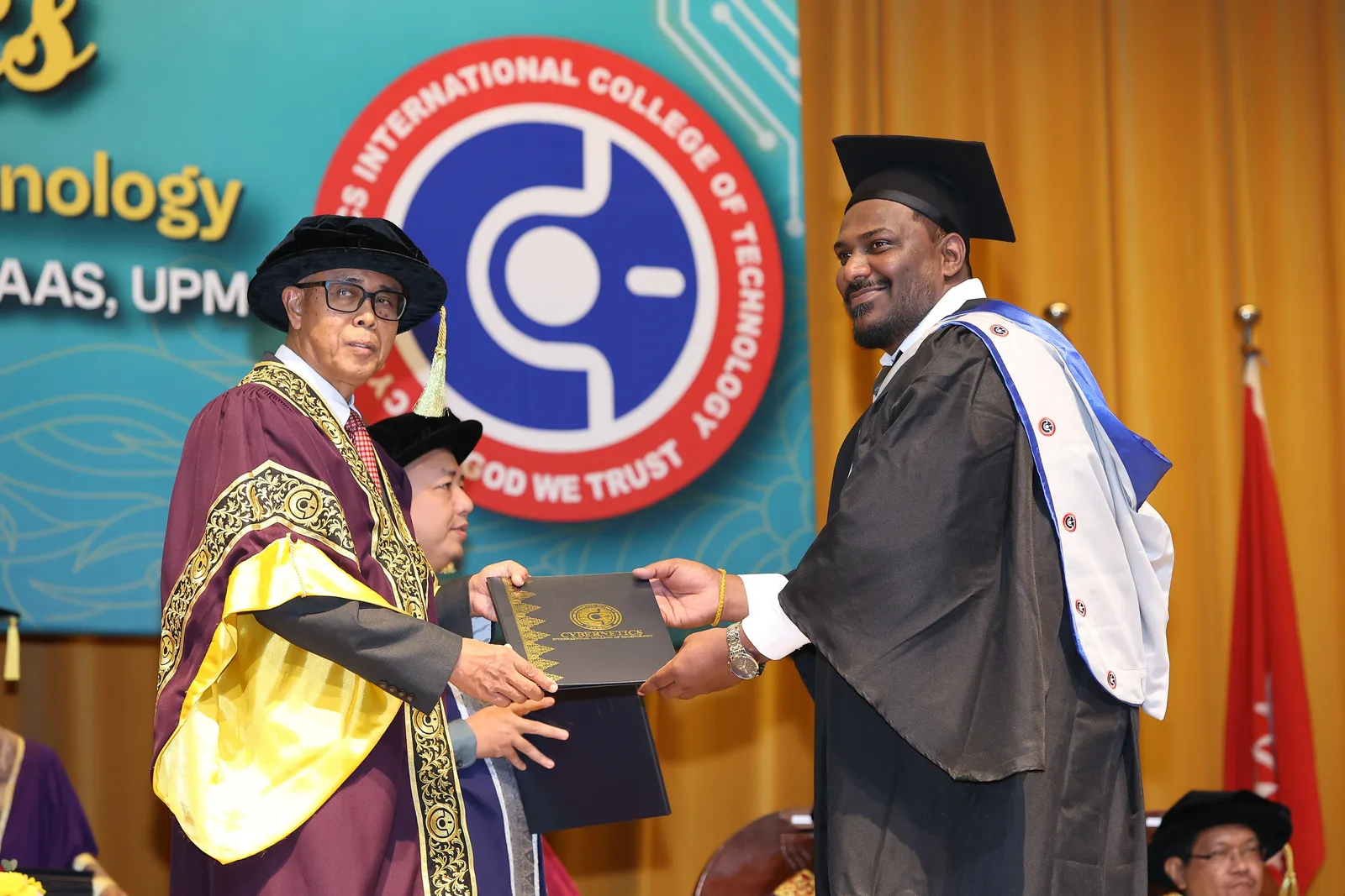 KTAC graduate receiving a certificate on the convocation stage