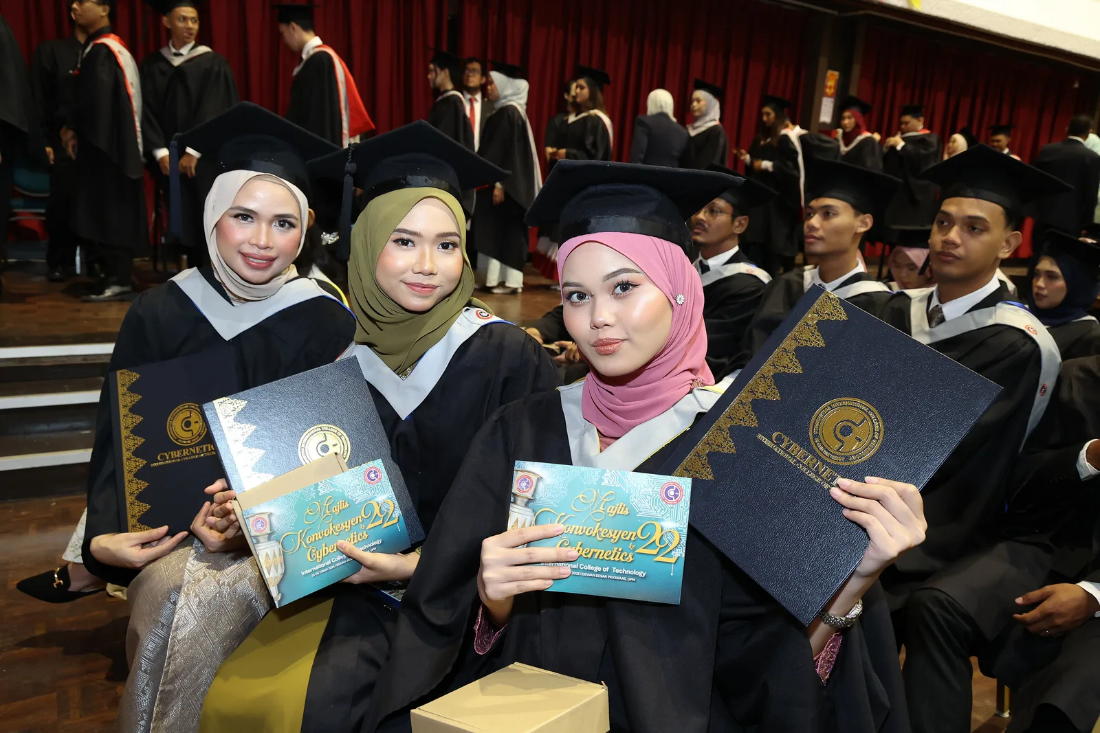 KTAC graduates posing with friends during convocation