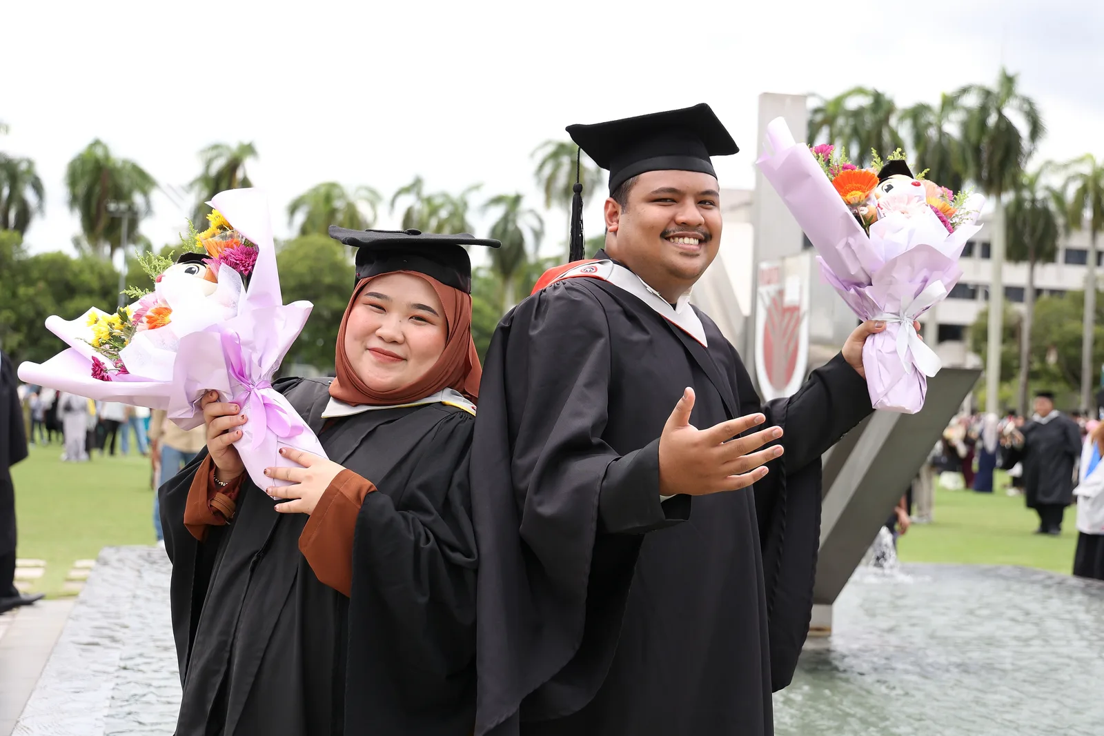 KTAC graduates posing outdoors after graduation